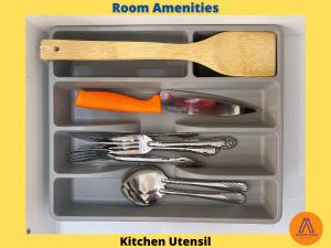 a plastic container with utensils in a drawer at Aurora Place Suites Kuala Lumpur Bukit Jalil by Rasa Sayang in Kuala Lumpur