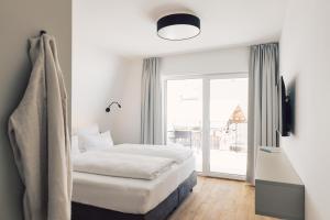 Postel nebo postele na pokoji v ubytování Sima-Apartments