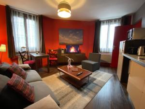 a living room with a couch and a coffee table at Loger à La Madeleine in La Madeleine