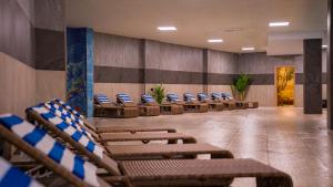 a row of chairs in a waiting room at Litz Resort in Kvariati