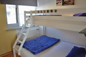 En eller flere senge i et værelse på Appartement Walvis nr. 12