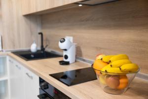 a bowl of fruit on a counter in a kitchen at Helena Holiday A in St. St. Constantine and Helena