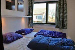 Postel nebo postele na pokoji v ubytování Appartement Walvis nr. 22B