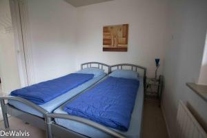 Ένα ή περισσότερα κρεβάτια σε δωμάτιο στο Appartement Walvis nr. 24