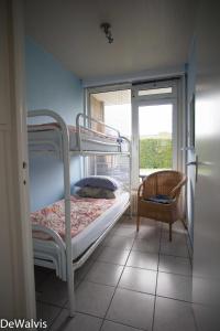 Ένα ή περισσότερα κρεβάτια σε δωμάτιο στο Appartement Walvis nr. 24