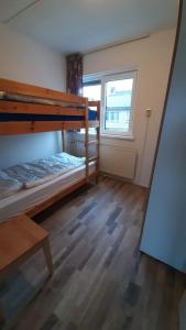 Ένα ή περισσότερα κρεβάτια σε δωμάτιο στο Appartement Walvis nr. 26B
