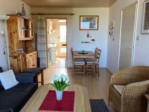 a living room with a couch and a table at Appartement Walvis nr. 9K in Vrouwenpolder