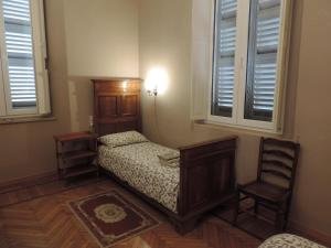 Postel nebo postele na pokoji v ubytování Casa Mappamondo