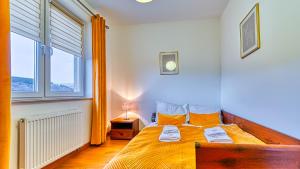 Posteľ alebo postele v izbe v ubytovaní Apartament Cichy - 5D Apartamenty