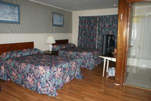Postel nebo postele na pokoji v ubytování Regent Motel