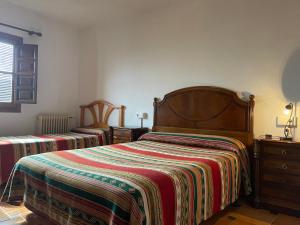 Postel nebo postele na pokoji v ubytování Hostal Rural Poqueira