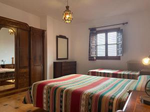 Postel nebo postele na pokoji v ubytování Hostal Rural Poqueira