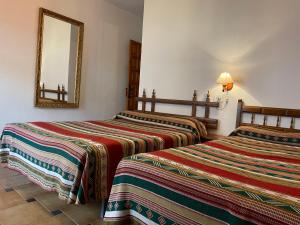 Postel nebo postele na pokoji v ubytování Hostal Rural Poqueira
