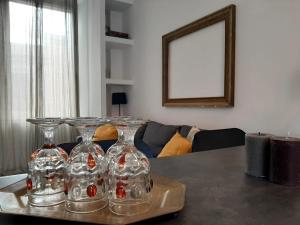 a tray with two wine glasses on top of a table at Loft Esquilino Terrazza a Stazione Termini in Rome