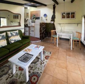 a living room with a couch and a table at Son de Mar Hotel rural & Apartamento in Quintueles +24 photos