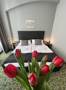 Ένα ή περισσότερα κρεβάτια σε δωμάτιο στο Hotel Boston