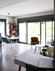 a living room with a table and chairs at Baviera Hills 1a in Málaga