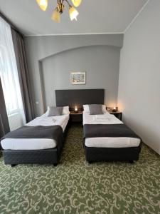 Ένα ή περισσότερα κρεβάτια σε δωμάτιο στο Hotel Boston