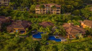 an aerial view of a house with a swimming pool at Los Suenos Resort Marbella 3D in Herradura