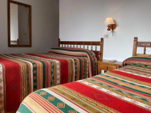 Postel nebo postele na pokoji v ubytování Hostal Rural Poqueira