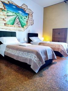Säng eller sängar i ett rum på Affittacamere di Andrea Bertolino Anzola dell'Emilia