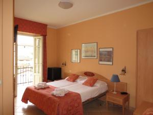 Postel nebo postele na pokoji v ubytování Hotel Massimo