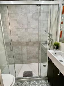 a bathroom with a shower and a sink at Sea Dreams with Amazing Terrace in Sitges +13 photos