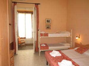Postel nebo postele na pokoji v ubytování Hotel Massimo
