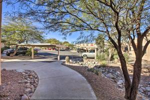 a sidewalk in front of a parking lot at Tranquil Green Valley Townhome with Mtn Views! in Green Valley