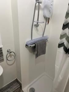 a bathroom with a towel rack and a sink at roosevelt lodge in Skegness +40 photos