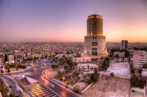 a view of a city with a tall building at Le Royal Amman in Amman