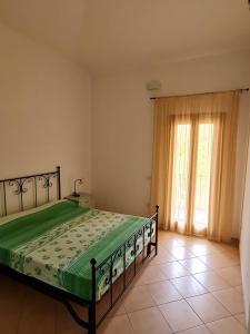 A bed or beds in a room at Dimora San Pietro