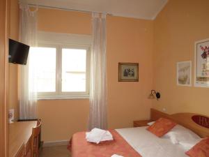 Postel nebo postele na pokoji v ubytování Hotel Massimo