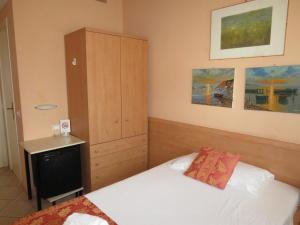 Postel nebo postele na pokoji v ubytování Hotel Massimo