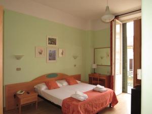 Postel nebo postele na pokoji v ubytování Hotel Massimo