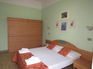 Postel nebo postele na pokoji v ubytování Hotel Massimo