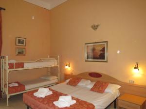 Postel nebo postele na pokoji v ubytování Hotel Massimo