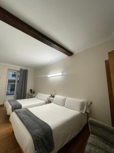 Кровать или кровати в номере Pensión Artea