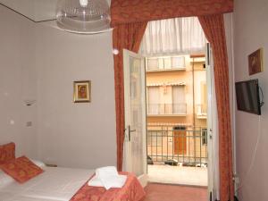 Postel nebo postele na pokoji v ubytování Hotel Massimo