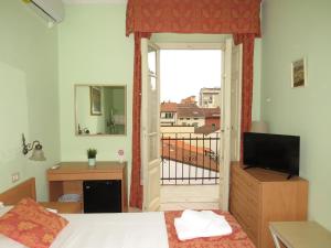 TV a/nebo společenská místnost v ubytování Hotel Massimo