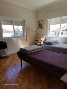 Ein Bett oder Betten in einem Zimmer der Unterkunft Alex Point - Guest House