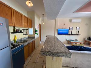 a kitchen with a counter top in a room at CENTRO, CERCA ToDo in Cancún +18 photos
