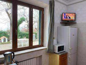 TV a/nebo společenská místnost v ubytování Casa Fabbrichina