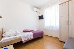 Posteľ alebo postele v izbe v ubytovaní Kelava Rooms