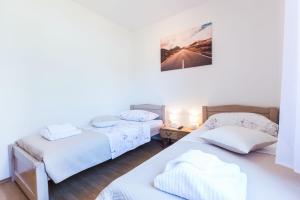 Posteľ alebo postele v izbe v ubytovaní Kelava Rooms
