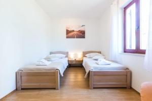 Posteľ alebo postele v izbe v ubytovaní Kelava Rooms + 12 fotografií