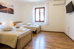 Posteľ alebo postele v izbe v ubytovaní Kelava Rooms