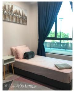 Postel nebo postele na pokoji v ubytování Meru Oasis at Casa Kayangan Ipoh