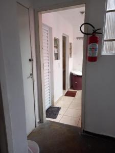 a hallway with a fire hydrant in a room at Pousada Landus in São Paulo +28 photos