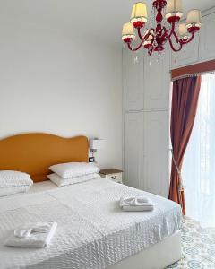 Postel nebo postele na pokoji v ubytování Dolce Vita Suite Alghero